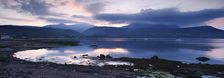 View across Brodick Bay to Beinn Tarsuinn and Goatfell at sunset, Arran, North Ayrshire, Scotland