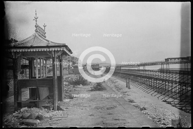 View along the Esplanade from beside a shelter, showing Admiralty scaffolding, Shanklin, IoW, 1945. Creator: George R Long.