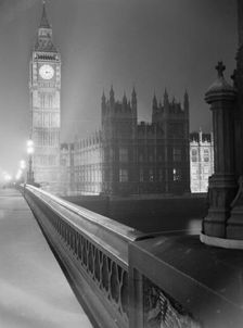 View at night along the south parapet of Westminster Bridge towards... Big Ben, early 1960s. Creator: John Gay