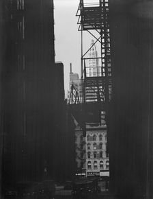 View between buildings of Mather Building/Tower in distance. Chicago, Illinois, c1896-c1942. Creator: Arnold Genthe