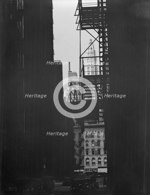 View between buildings of Mather Building/Tower in distance. Chicago, Illinois, c1896-c1942. Creator: Arnold Genthe.