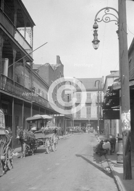 View down a street, New Orleans or Charleston, South Carolina, between 1920 and 1926. Creator: Arnold Genthe.