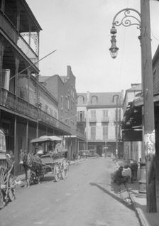 View down a street, New Orleans or Charleston, South Carolina, between 1920 and 1926. Creator: Arnold Genthe