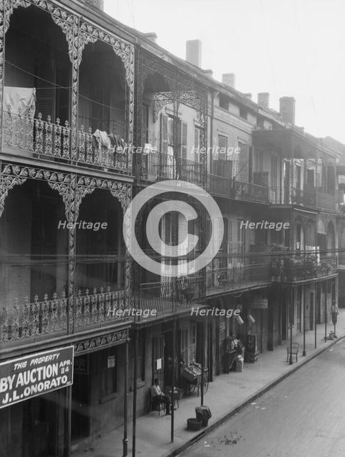 View down a street, New Orleans, between 1920 and 1926. Creator: Arnold Genthe.