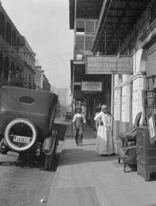 View down a street, New Orleans, between 1920 and 1926. Creator: Arnold Genthe