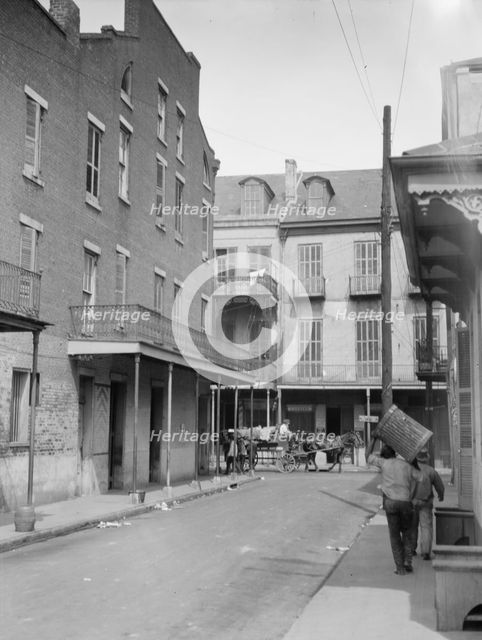 View down a street, New Orleans, between 1920 and 1926. Creator: Arnold Genthe.