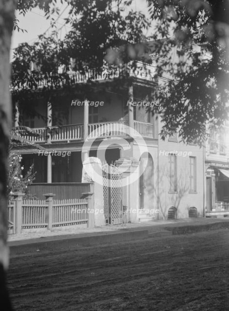View from across street of a multi-story house, [25 Franklin Street], Charleston..., c1920-1926. Creator: Arnold Genthe.