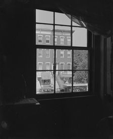View from the bedroom window of Mrs. Ella Watson, a government worker, Washington, D.C., 1942. Creator: Gordon Parks
