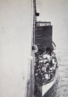 View from the Carpathia of a lifeboat from the Titanic brought alongside, 15 April, 1912. Creator: Unknown