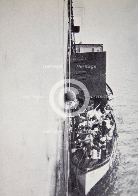 View from the 'Carpathia' of a lifeboat from the 'Titanic' brought alongside, 15 April, 1912. Creator: Unknown.