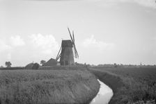 View from the north looking towards Sneath's Mill, Lutton Gowts, Lutton, Lincolnshire, 1936. Creator: HES Simmons