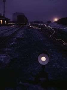 View in a departure yard at C & NW RR's Proviso (?) yard at twilight, Chicago, Ill., 1942. Creator: Jack Delano