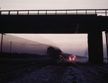View in a departure yard at C & NW RR's Proviso (?) yard at twilight, Chicago, Ill., 1942. Creator: Jack Delano