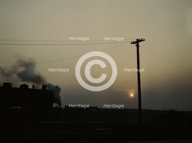 View in a departure yard at C & NW RR's Proviso (?) yard at twilight, Chicago, Ill., 1942. Creator: Jack Delano.