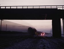 View in a departure yard at C & NW RR's Proviso (?) yard at twilight, Chicago, Ill., 1942. Creator: Jack Delano