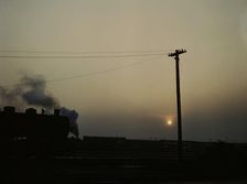 View in a departure yard at C & NW RR's Proviso (?) yard at twilight, Chicago, Ill., 1942. Creator: Jack Delano