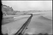 View looking north-east from Shanklin Beach, showing Admiralty scaffolding, Isle Of Wight, 1945. Creator: George R Long