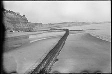 View looking north-east from Shanklin Beach, showing Admiralty scaffolding, Isle Of Wight, 1945. Creator: George R Long