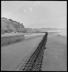 View looking north-east of Shanklin Beach, showing Admiralty scaffolding, Isle Of Wight, 1945. Creator: George R Long