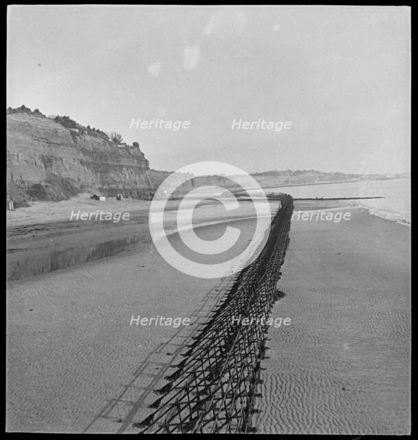 View looking north-east of Shanklin Beach, showing Admiralty scaffolding, Isle Of Wight, 1945. Creator: George R Long.