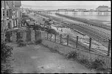 View looking south along the beach at Shanklin, showing Admiralty scaffolding, Isle Of Wight, 1945. Creator: George R Long