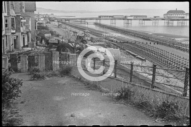 View looking south along the beach at Shanklin, showing Admiralty scaffolding, Isle Of Wight, 1945. Creator: George R Long.