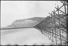 View looking south along the beach at Shanklin, showing Admiralty scaffolding, Isle Of Wight, 1945. Creator: George R Long