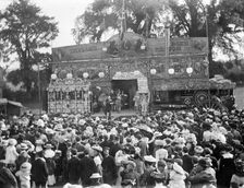 View of Taylor's Cinematograph show and crowd at Witney Fair, Witney, Oxfordshire, 1860-1922. Creator: Henry Taunt
