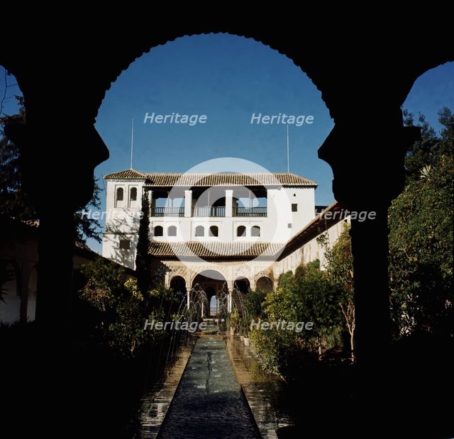 View of the courtyard of the ditch with the gardens and fountains of the Alhambra, at the bottom …