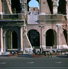 View of the Colosseum with cabs in front