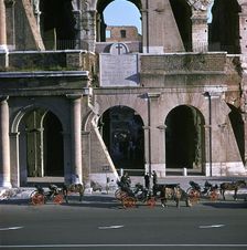 View of the Colosseum with cabs in front