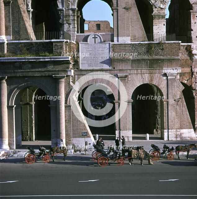 View of the Colosseum with cabs in front. Artist: Unknown
