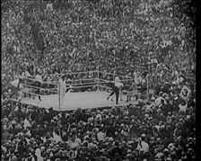 View of the Boxing Ring at a Crowded Sports Stadium for a Match Between George Carpentier..., 1921. Creator: British Pathe Ltd