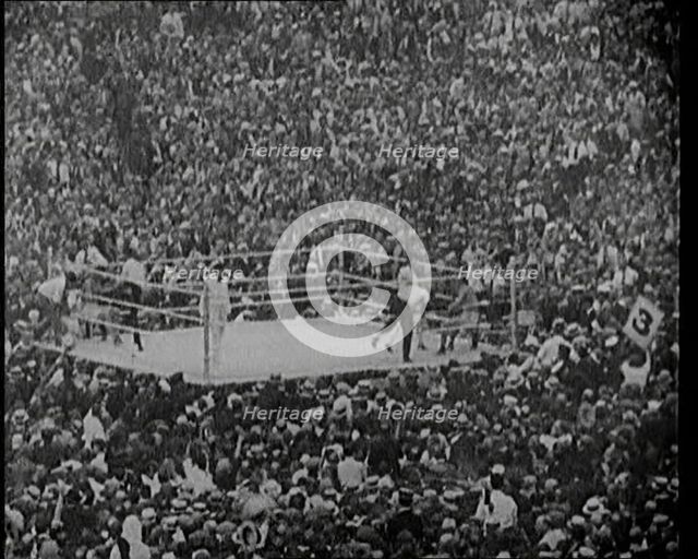 View of the Boxing Ring at a Crowded Sports Stadium for a Match Between George Carpentier..., 1921. Creator: British Pathe Ltd.