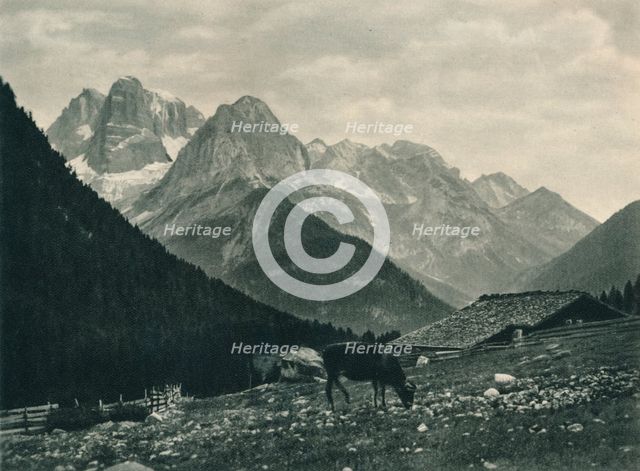 View of the Brenta Group with alpine pasture, Madonna di Campiglio, Dolomites, Italy, 1927. Artist: Eugen Poppel.