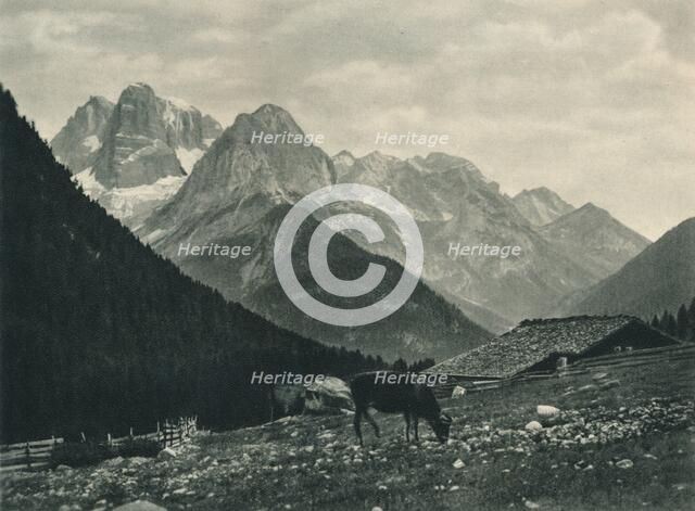View of the Brenta Group with alpine pasture, Madonna di Campiglio, Dolomites, Italy, 1927. Artist: Eugen Poppel.