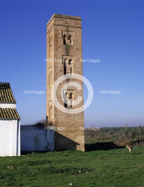 View of the brick square tower of the Cuatrovitas chapel, old Almohad mosque in Bollullos de la M…