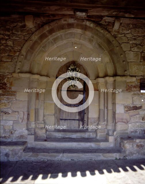 View of the door of the hermitage of San Pelayo, both the door and windows are pointed, the bell …