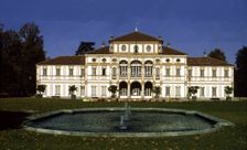 View of the exterior of the building and gardens of the Treasury Villa