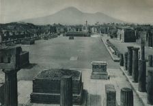View of the forum with Mount Vesuvius in the distance, Pompeii, Italy, 1927. Creator: Eugen Poppel