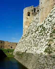 View of walls and moat, Krak des Chevaliers, Talkalakh District, Syria Arab Republic, 1999. Creator: LTL