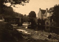 View of a stone bridge, river and buildings in a village, probably in France , c1890. Creator: Edgar Haincque de Saint-Senoch
