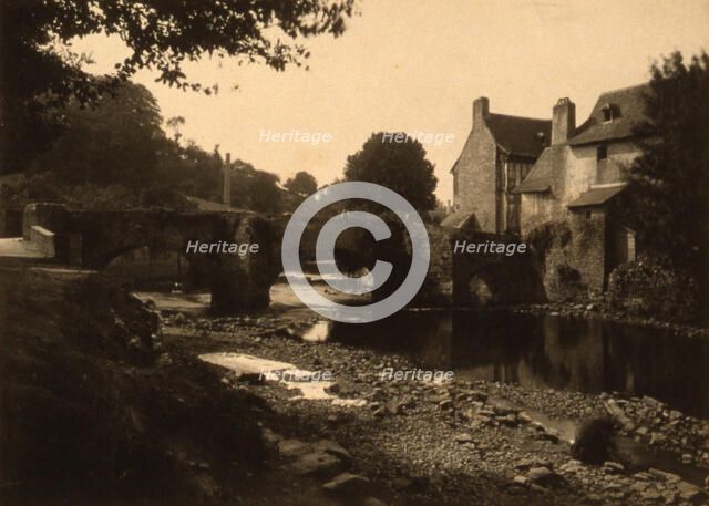 View of a stone bridge, river and buildings in a village, probably in France , c1890. Creator: Edgar Haincque de Saint-Senoch.