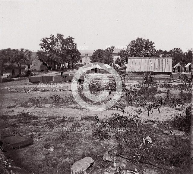 [View of a small town with wooden sheds in distance]. Brady album, p. 123, 1861-65. Creator: Unknown.