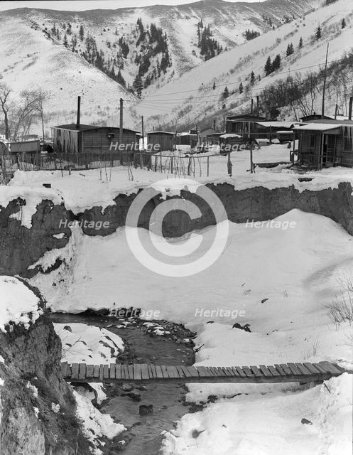 View of company-owned houses, Utah coal town, Consumers, near Price, Utah, 1936. Creator: Dorothea Lange.