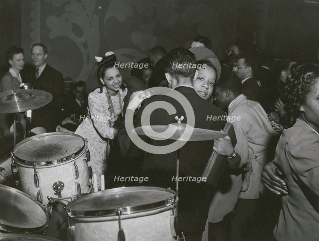 View of crowd dancing to the music of "Red" Sounders and his band, at the Club DeLisa..., April 1942 Creator: Jack Delano.