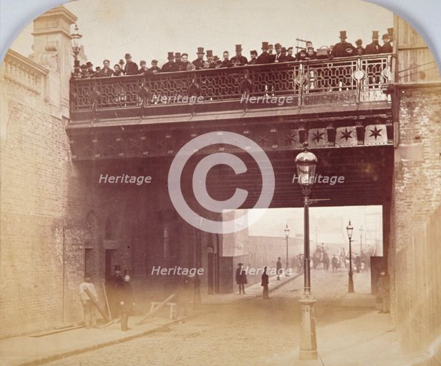View of figures looking over the south side of Shoe Lane Bridge, City of London, 1869. Artist: Henry Dixon