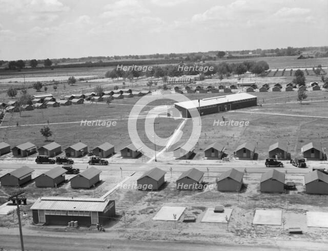 View of FSA camp Farmersville seen from water tower, Tulare County, California, 1939. Creator: Dorothea Lange.