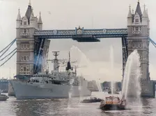 View of HMS London sailing beneath Tower Bridge, London, 1988. Artist: Anon
