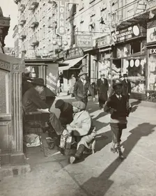View of Lenox Avenue, Harlem, at 135th Street, showing businesses, pedestrians and..., 1939. Creator: Unknown